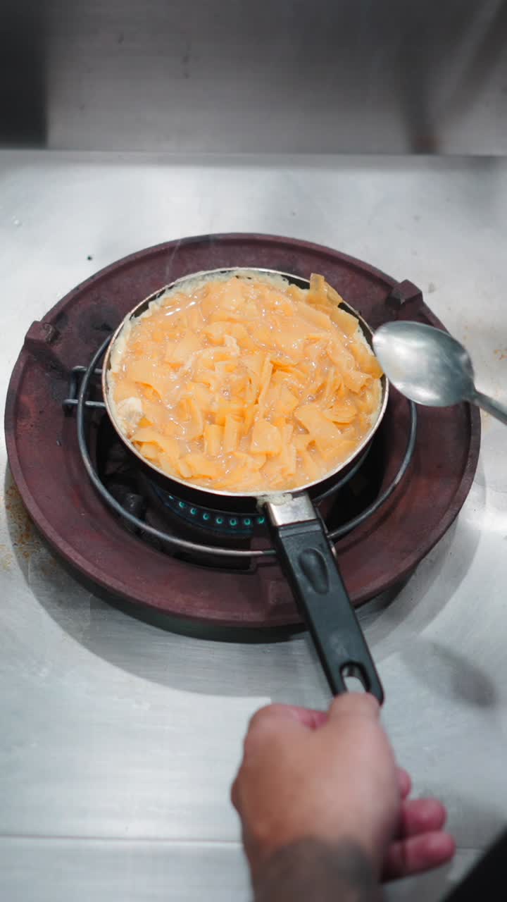 Cooking an omelet on a stove