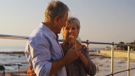 Senior-couple-having-ice-cream-at-promenade-4k