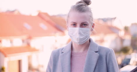 woman put protective mask on face