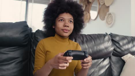 teenage girl playing video game in the living room