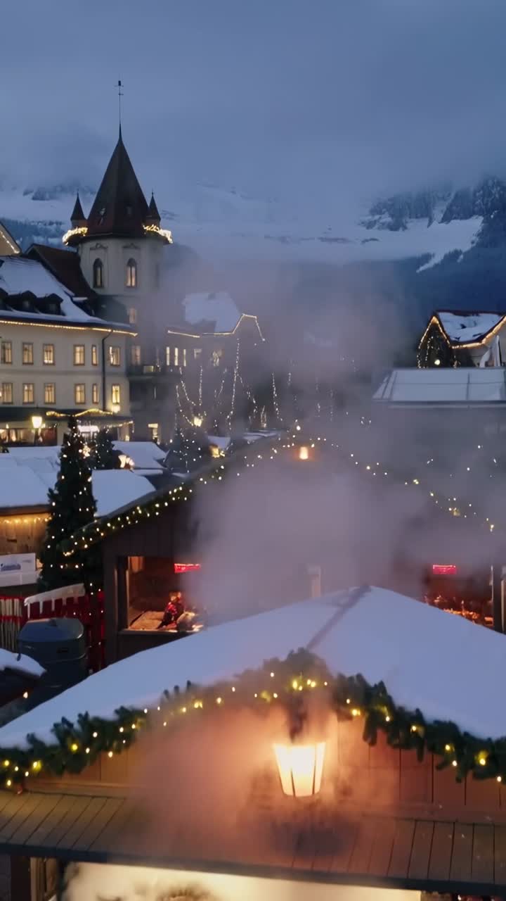 Vertical video: Drifting steam from vent swirling around stall at dusk town square, with lantern