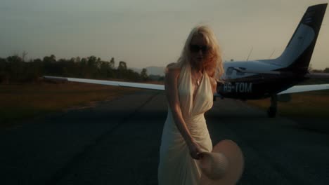 woman at an airport sunset