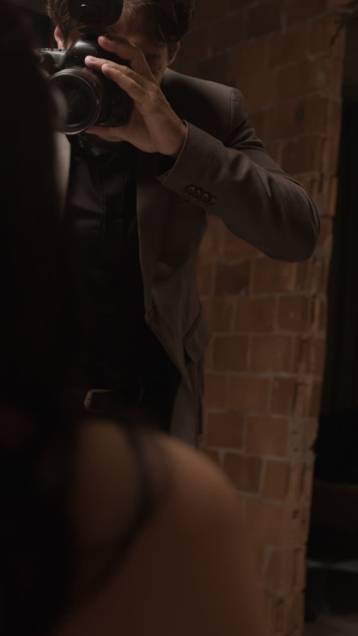 Photographer taking pictures of a model