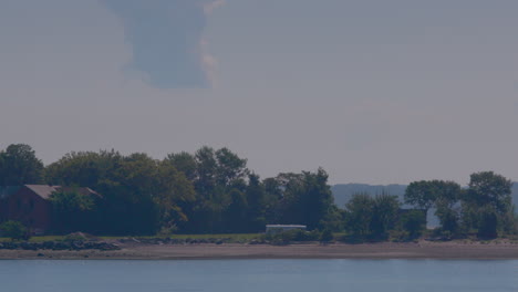 Graves are being dug on Hart Island during the day with an excavator