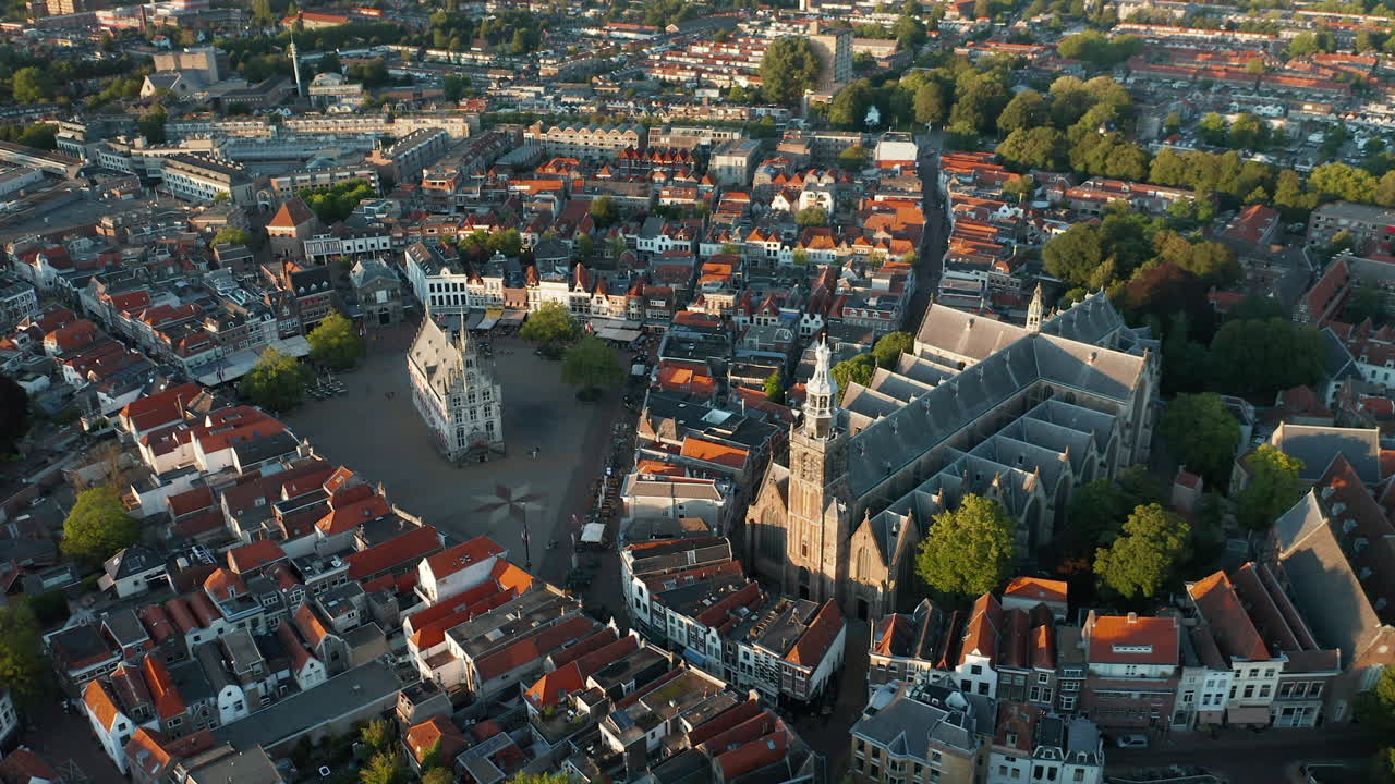 Aerial View Of Saint-John Church Adjacent To Gouda's 15th Century Town Hall And Gouda City In Netherlands