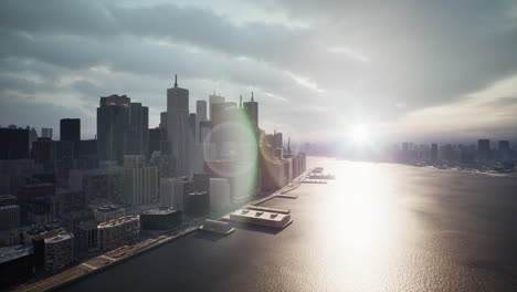 aerial view of a modern city skyline at sunrise/sunset