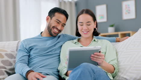 Relax,-tablet-and-ecommerce-couple-on-sofa