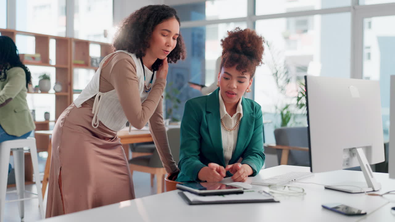 Businesswomen collaborating in a modern office