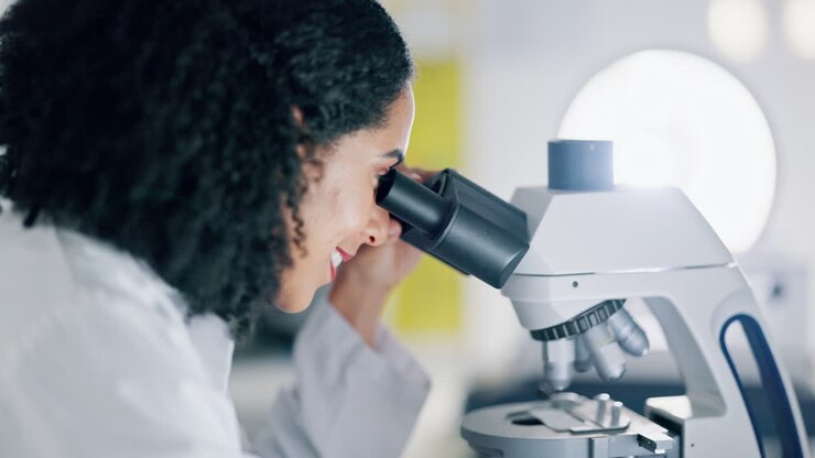 Medical, research and woman with microscope