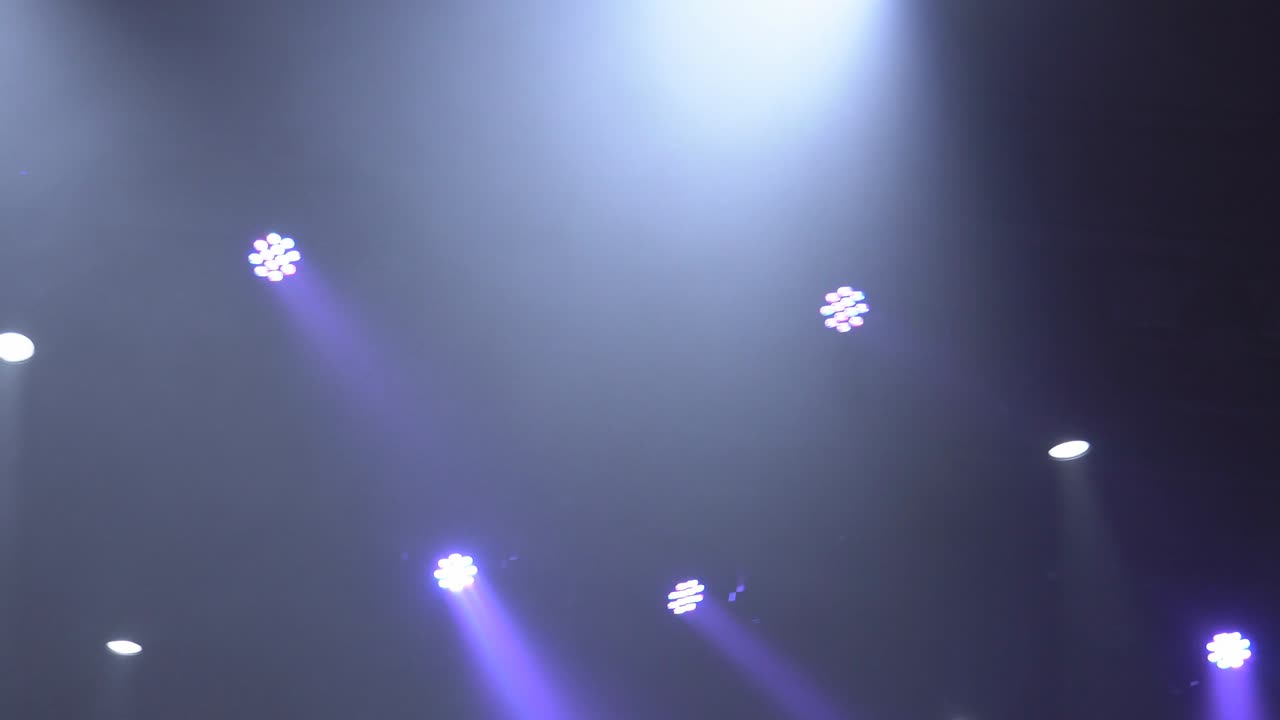 Stage lights shining at studio. Seamless looping animation.