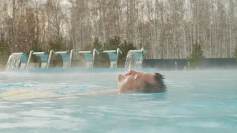 man relaxing in a hot tub