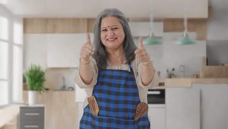 Happy-Indian-aged-housewife-showing-thumbs-up