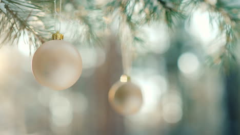 Christmas-Balls-Hang-On-A-Green-Branch-Of-A-New-Year-Tree-In-A-Winter-Forest-At-Sunset