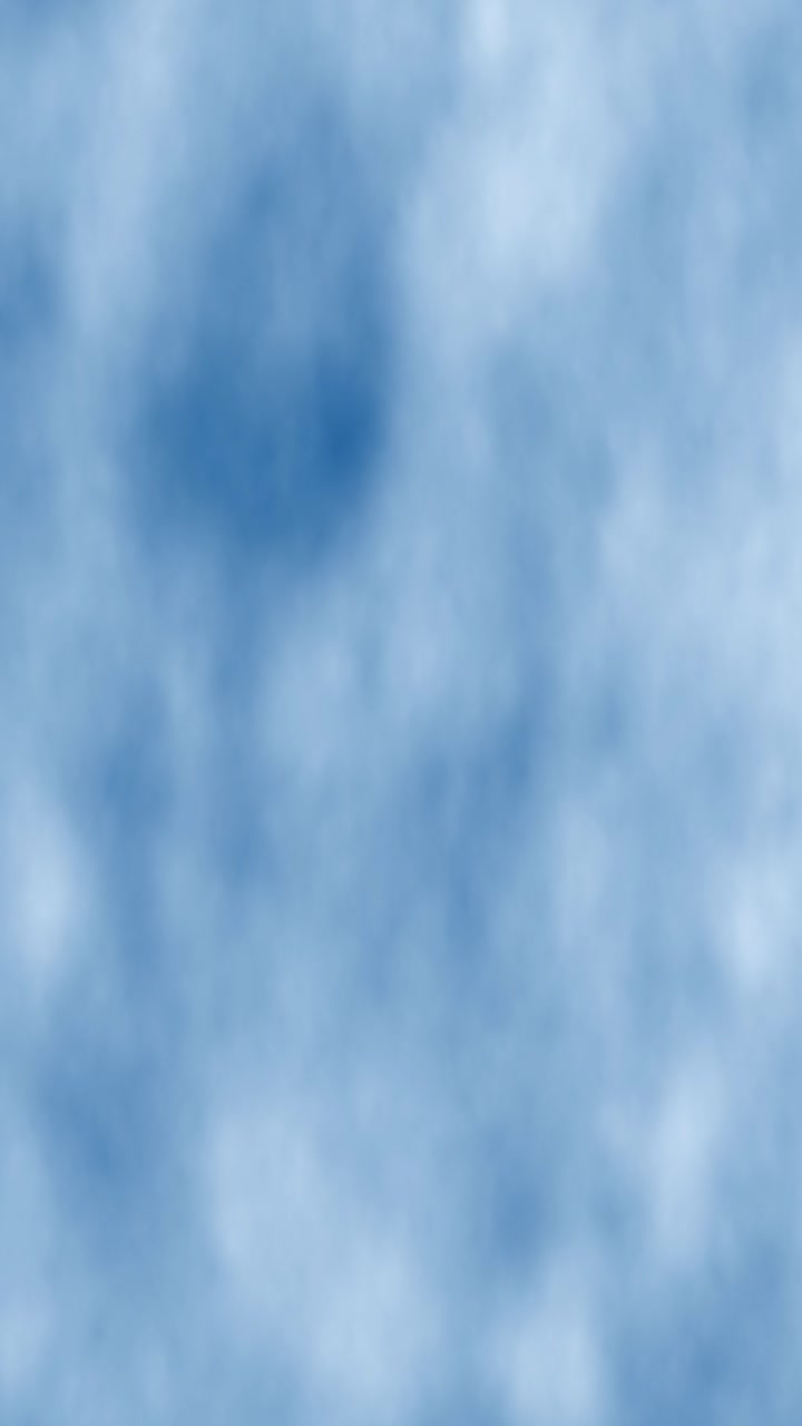 Gently moving blue and white watercolor or cloud texture. Vertical format seamless loop perfect for calm social media stories, reels, or wellness content