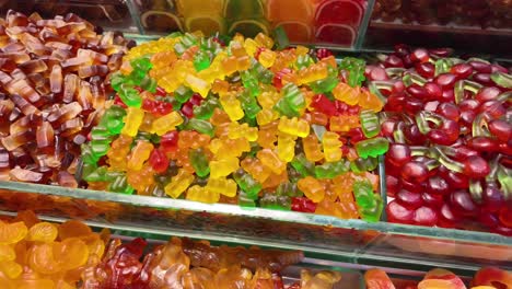 a vibrant display of assorted gummy candies including bears and cherries