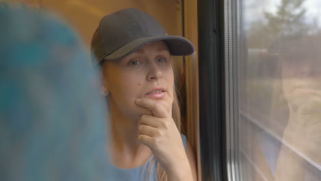 female photographer traveling by train