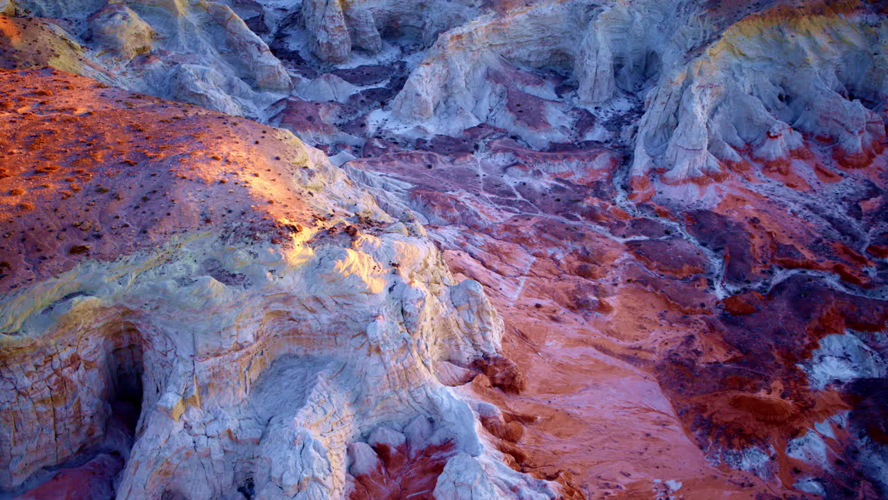 The drone drifts slowly over the multi-colored hills and fascinating rock pillars near the Utah-Arizona border.