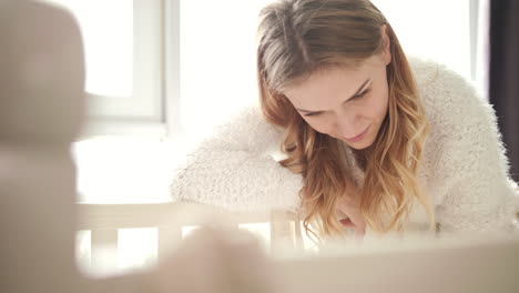 Beauty-mother-looking-on-baby-sleeping-girl.-Sweet-motherhood