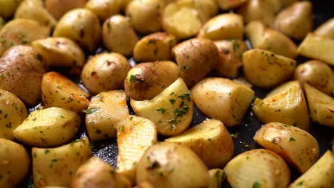 raw potatoes cut into irregular pieces with seasonings ready to cook