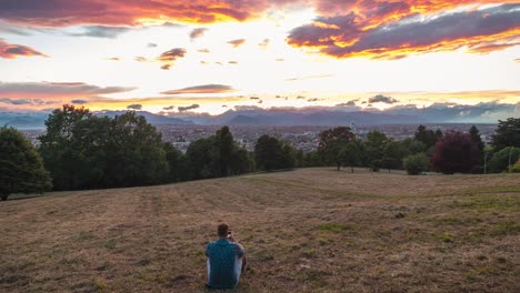 timelapse from sunset to an evening watching from high up the hill, panoramic cityscape view of turin italy