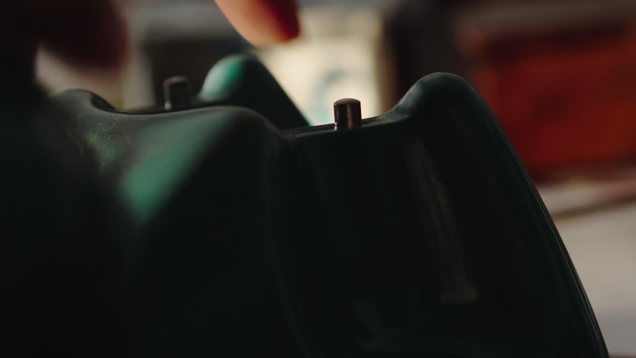 Close-up of a person's hand picking up the receiver of a dialer phone and trying to make a call