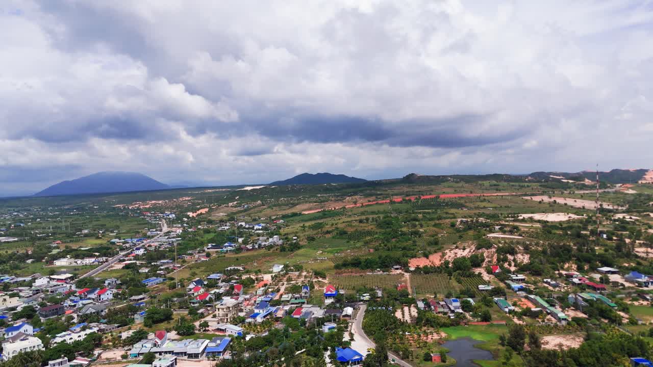 Aerial View Tilt of the Boat on the Beach and the City in Binh Thuan (Vietnam) During the Rainy Season