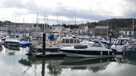 sailboats and yachts moored on sunny luxury conwy marina north wales