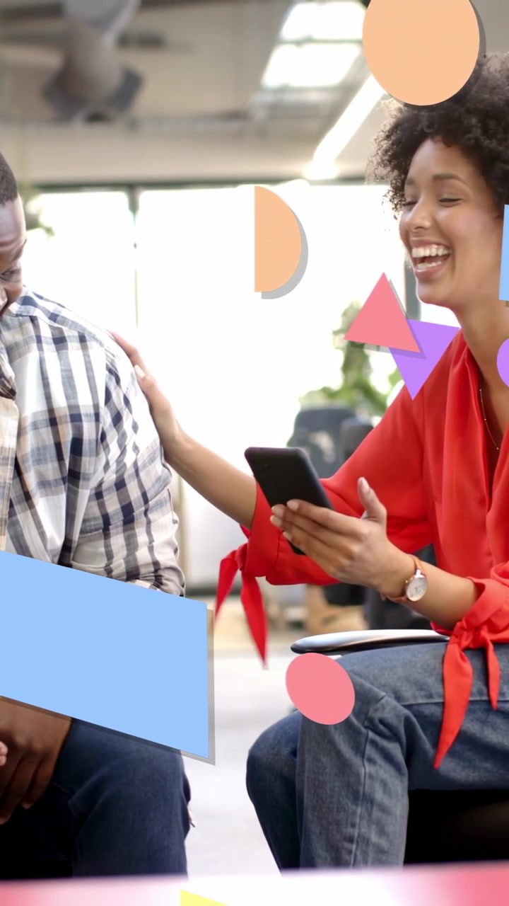 Vertical video: Woman handing phone to man leaning, sharing biz info, shapes moving across frame
