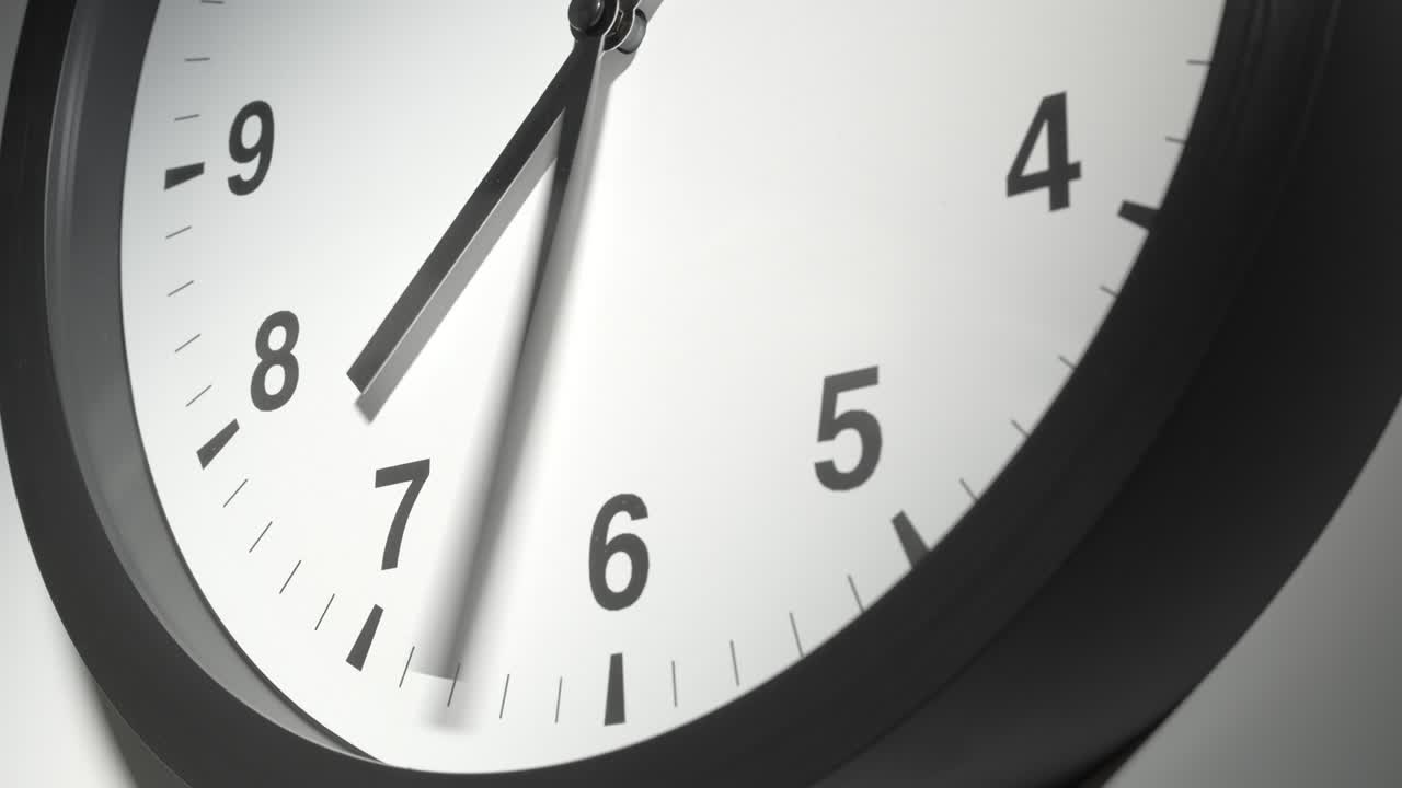 Clock Face in Time Lapse on White Wall in Office