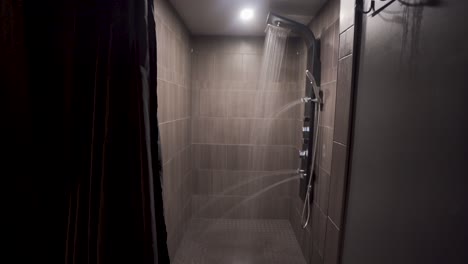 Push-in-shot-to-a-fancy-shower-with-lights-and-water-running