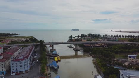 aerial static of wide indian ocean and car bridge in mallaca city,malaysia