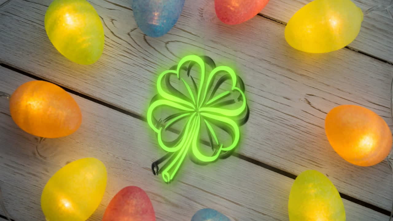 Glowing green shamrock animation over colorful Easter eggs on wooden background