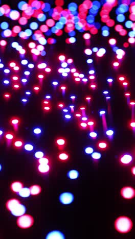 multicolored leds moving in waves. vertical looped video