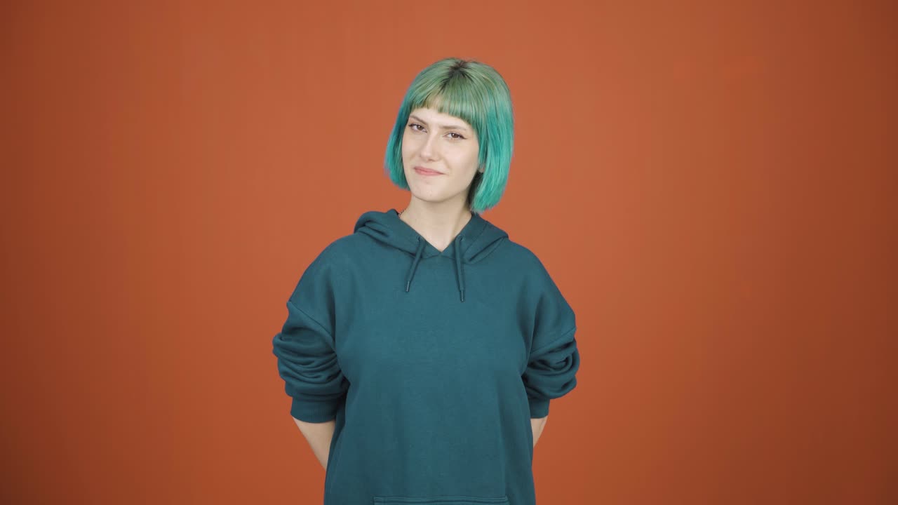 Young woman winking at camera.