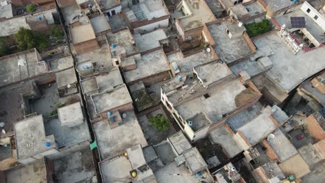 drone flying over a village society in pakistan