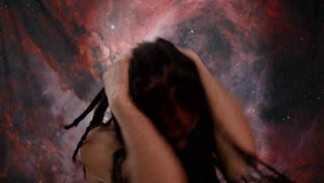afro-spanish man wrestling with inner voices. cosmic nebula backdrop