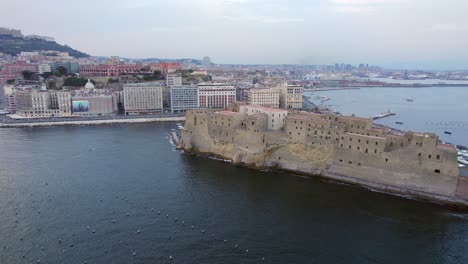 4K-Aerial-of-Naples,-Italy-at-sunset