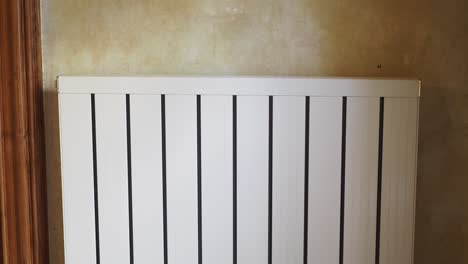 white radiator on a wall in a room