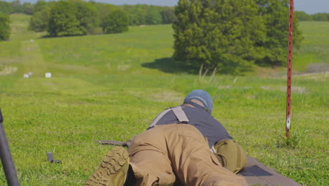 marksman aiming to shoot target at the shooting range