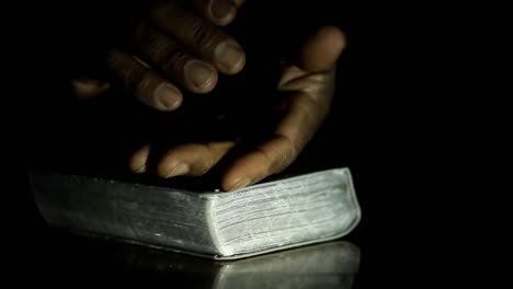 man praying to god with hands together on black background with people stock video