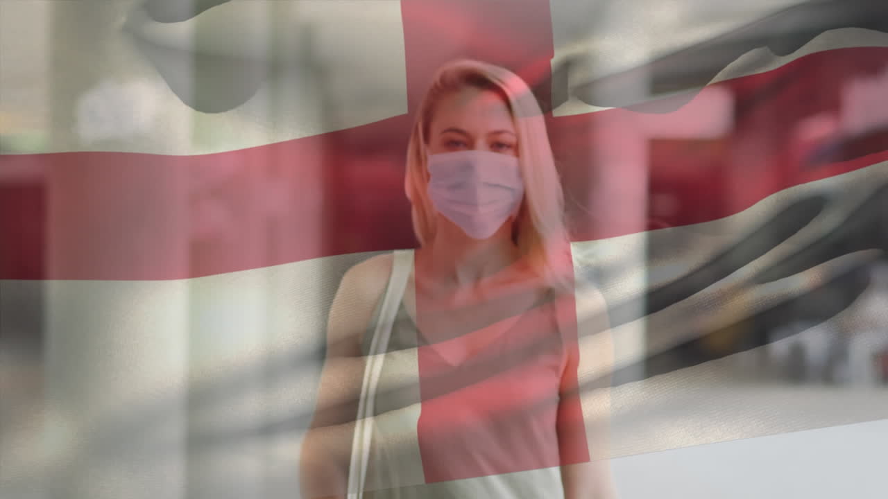 animación de la bandera de inglaterra ondeando sobre una mujer que usa una máscara facial durante la pandemia de covid-19