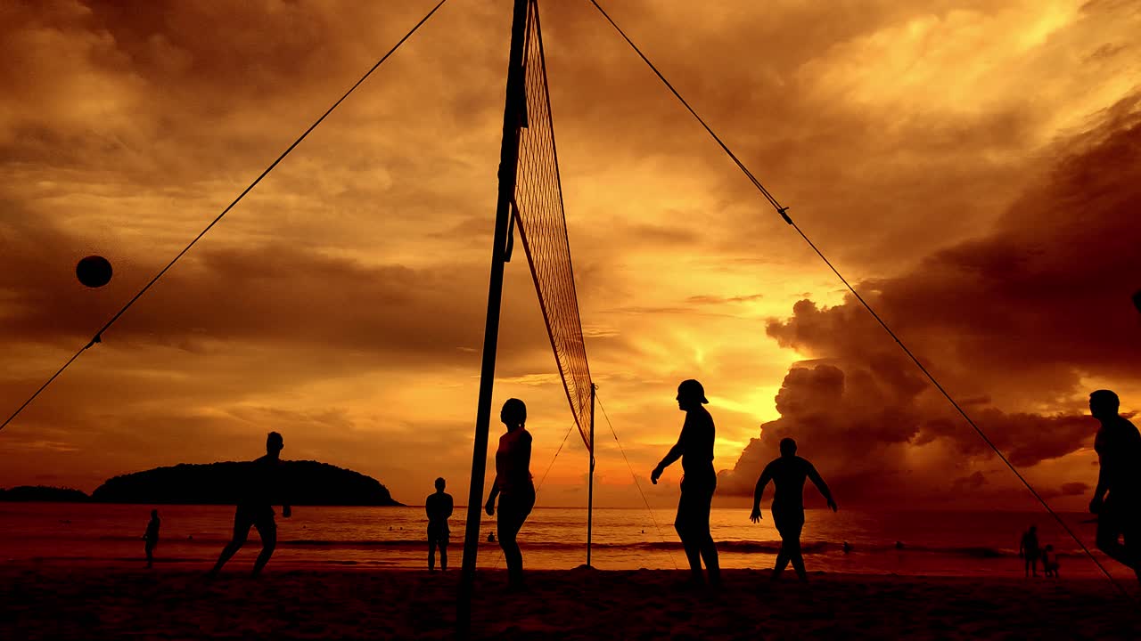 Volleyball at sunset on the beach