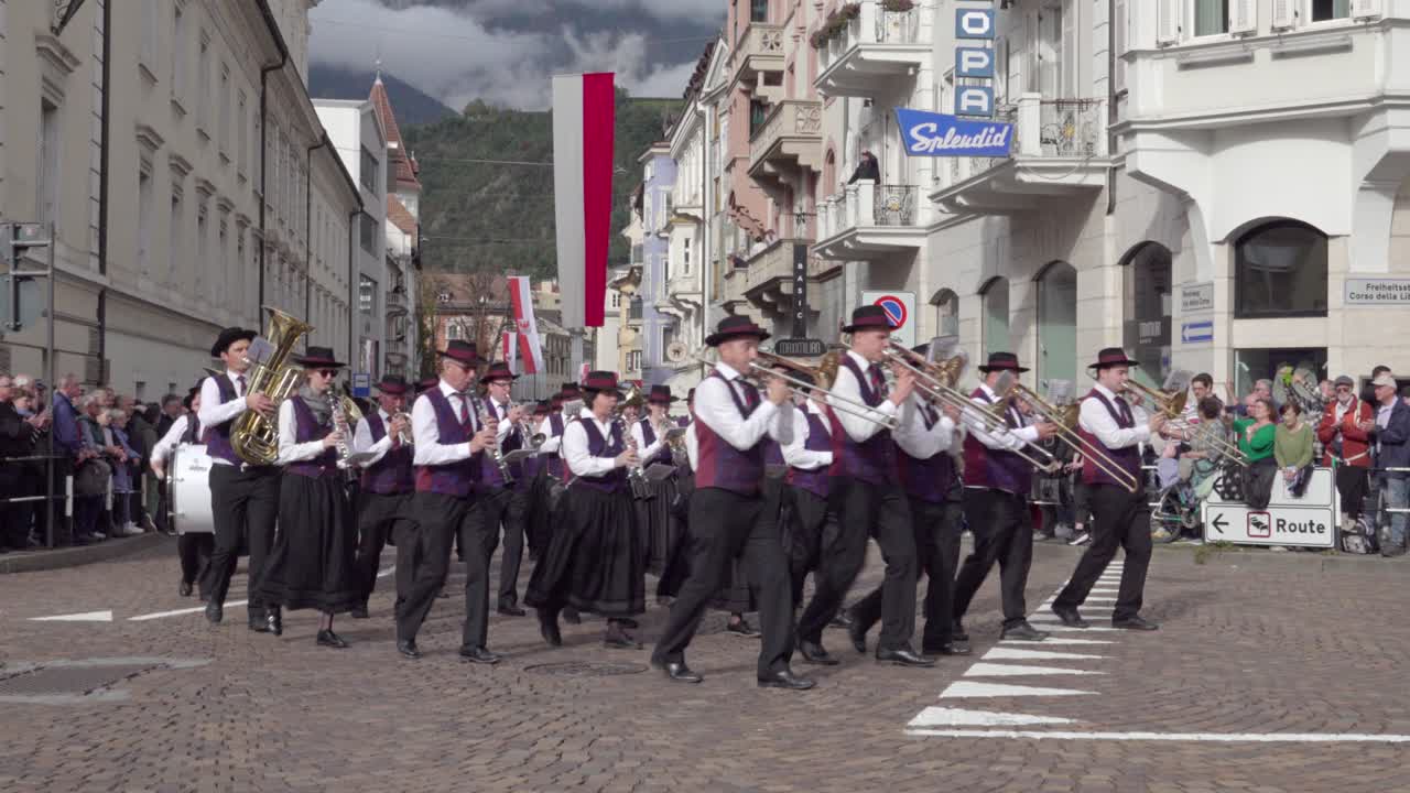 A Marching Band Parade Through a European Town