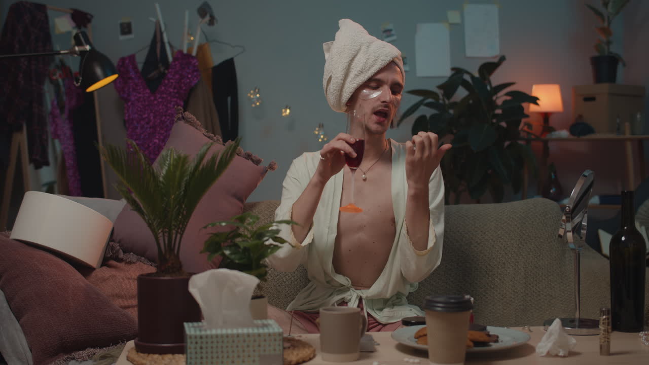 Person wearing a towel and robe in a living room