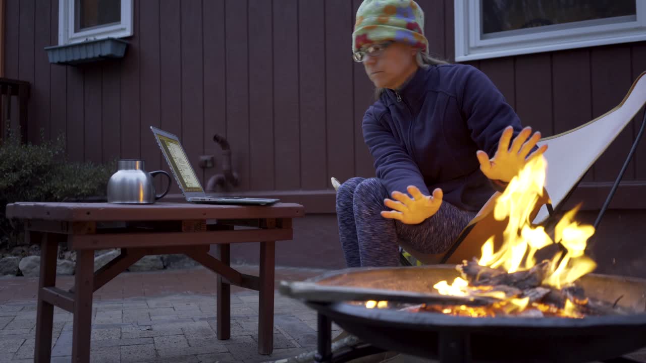 Woman Working by Fire Pit