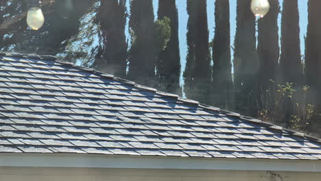 the evaporation of the morning dew on a roof when the first rays of sunlight shine on it