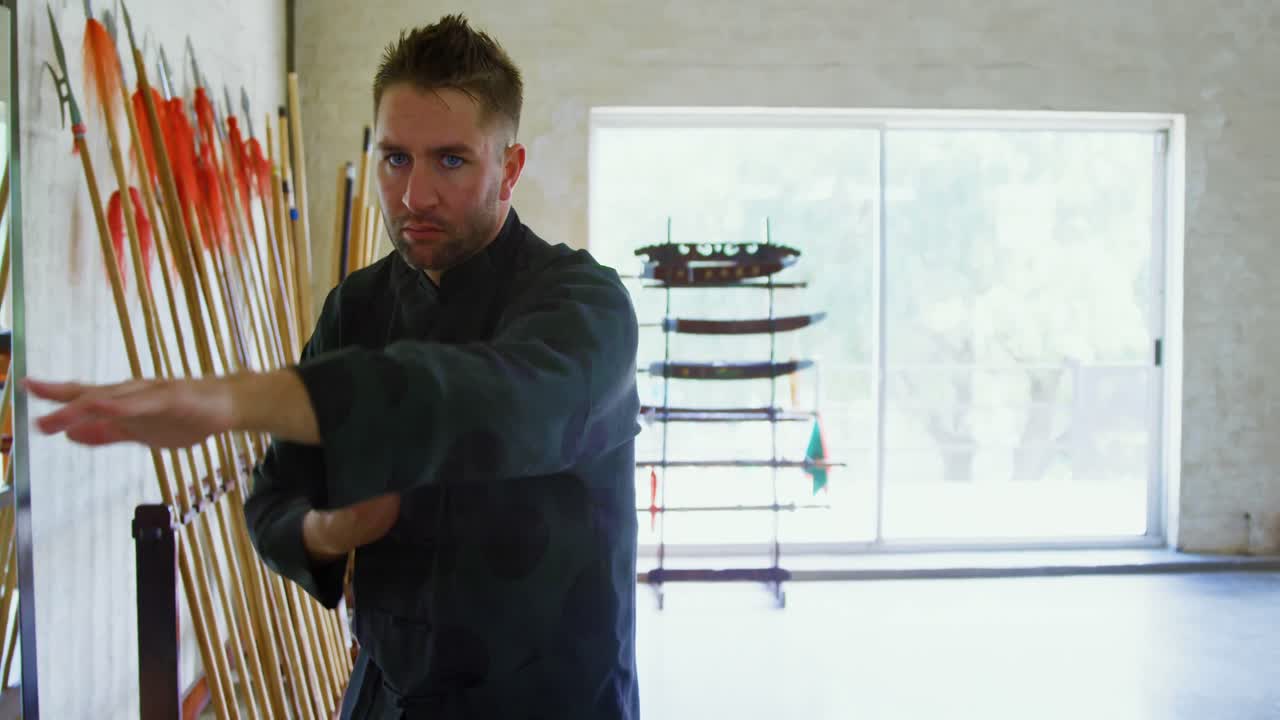 Kung fu fighter practicing martial arts 4k