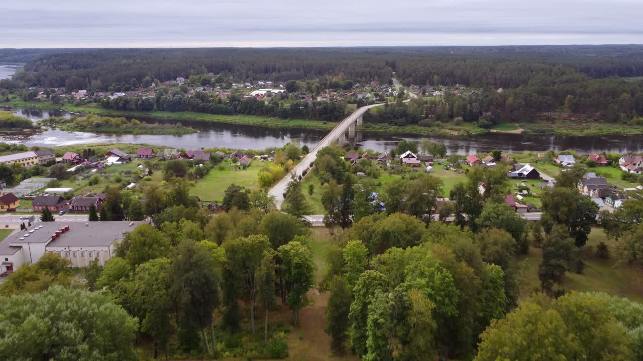Aerial View of a Town with a River, Bridge, and Manor House