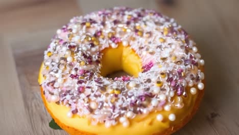 closeup of a delicious glazed donut with sprinkles