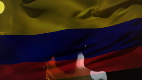 animation of flag of colombia over biracial couple kissing